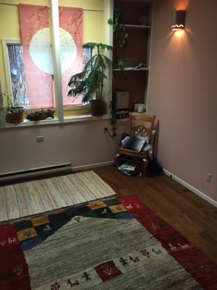 Our treatment room is a serene and beautiful space with a lush and thick oriental rug that's great to lie on while receiving a Breema treatment.